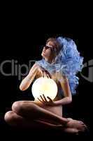 Pretty young woman holding light lamp