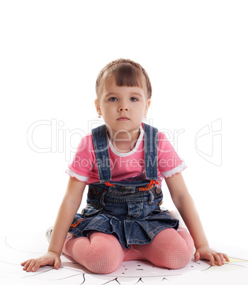 Little girl sitting on floor