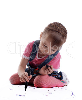 Cute little girl drawing on floor