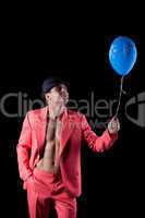 Man in red suit with blue balloon
