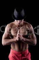 Muscular dancer in hat