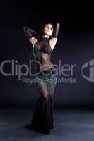 Beautiful oriental dancer in black dress