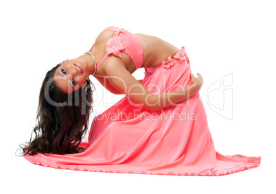 Smiling oriental dancer in pink costume