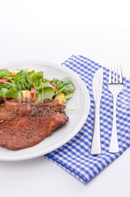 cervical chop with apricot-rocket salad