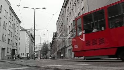 Red tram in the bw city