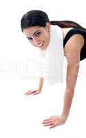 Female fitness trainer doing push ups