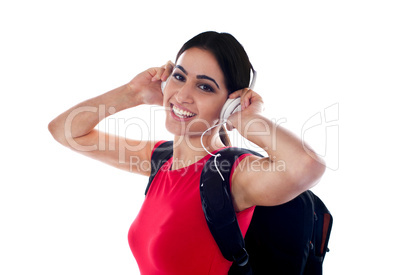 Trendy casual girl listening to music