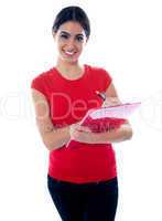 Young pretty girl preparing report