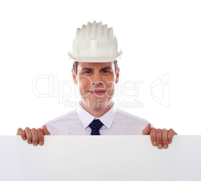 An architect holding blank white placard