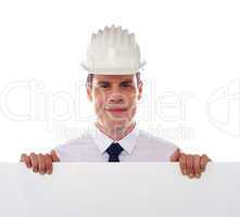 An architect holding blank white placard