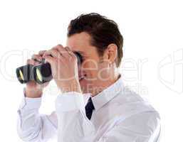 Male executive looking through binoculars