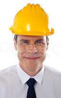 An architect wearing yellow safety helmet