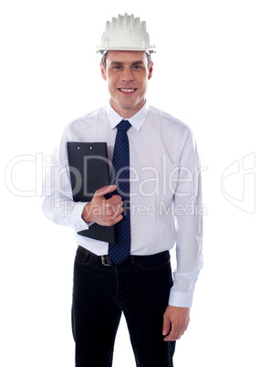 Young architect holding clipboard