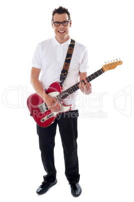 Full shot of a young man with guitar