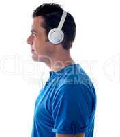 Side pose of a man with headphones