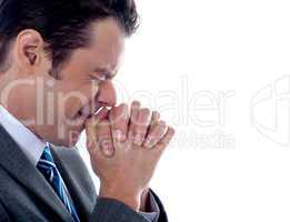 Business executive praying to god