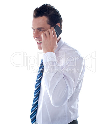 Side view of manager attending phone call