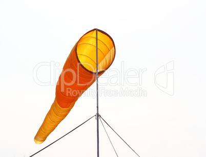 Wind direction Flag on blue cloud sky in  wind