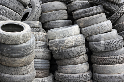 background with old tires on each other