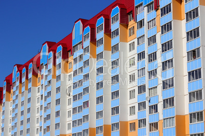 The inhabited high house against the blue sky