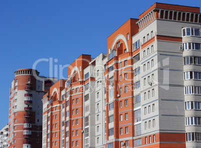 The inhabited high house against the blue sky