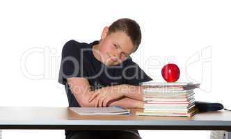 Teenager with pile of books and an apple