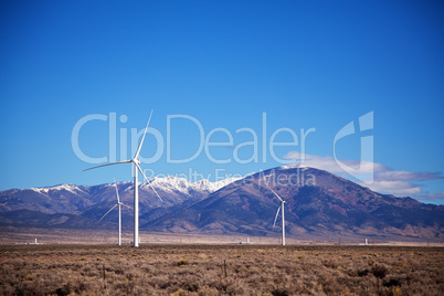 Power mills field in front of the mountain range