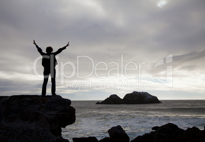 Woman staying with raised hands