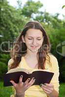 Teen girl reading book