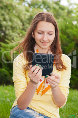 teen girl reading electronic book