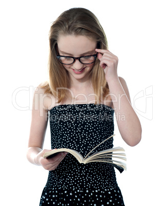 Beautiful girl reading book