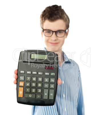 Young boy showing digital calculator