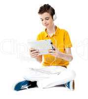 Seated boy watching video on tablet