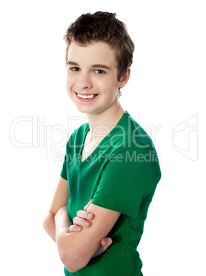 Young boy posing with folded arms