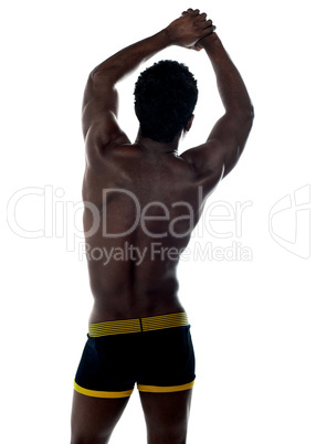 Shirtless african fit guy. Back pose