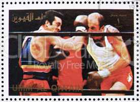 Postage stamp Umm al-Quwain 1972 Boxing, Olympic Games of the pa