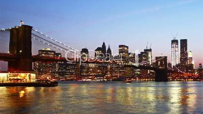 Beautiful view of Manhattan skyline and Brooklyn bridge at sunset, time lapse