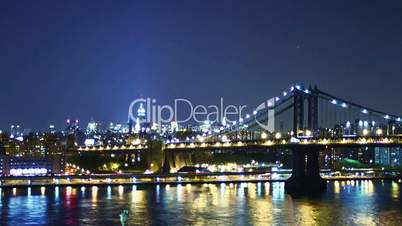 New York skyline and Manhattan bridge at night. Time lapse and loopable