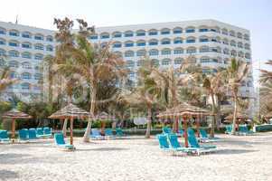 Beach and building of the luxury hotel, Ajman, UAE