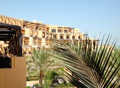Building of the luxury hotel and palm frond, Ras Al Khaimah, UAE