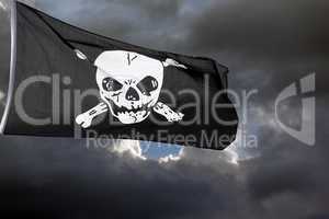 Jolly Roger (pirate flag) against storm clouds