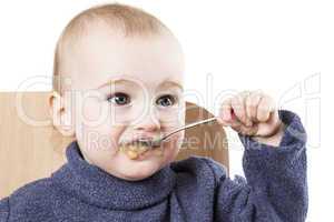 baby eating applesauce