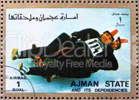 Postage stamp Ajman 1973 Two-man Sledge, Winter Olympics