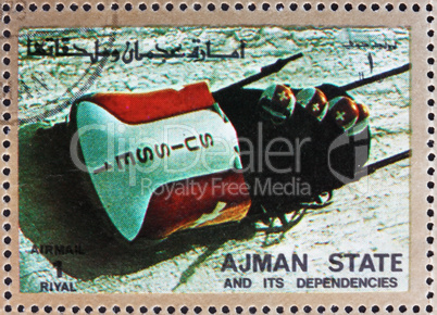 Postage stamp Ajman 1973 Four-man Bobsled, Winter Olympics