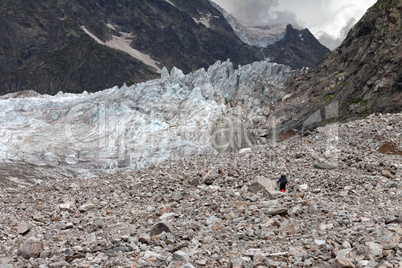 Hiker on glacier moraine