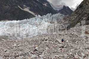 Hiker on glacier moraine