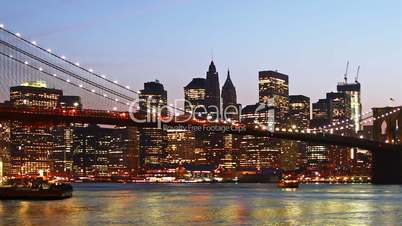 Beautiful view of Manhattan skyline and Brooklyn bridge at sunset, time lapse