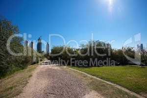 skyscrapers on a background of blue sky and the park