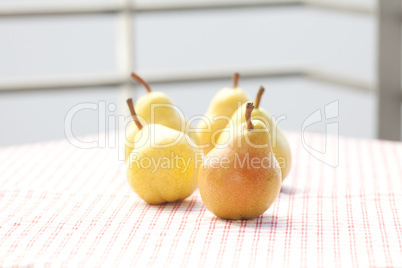 pears lying on a plaid fabric