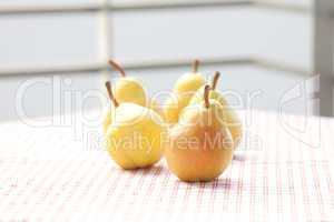 pears lying on a plaid fabric